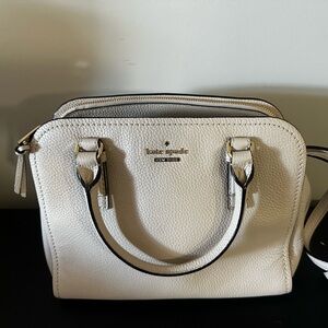 Kate spade ivory handbag with crossbody strap.  Perfect condition!